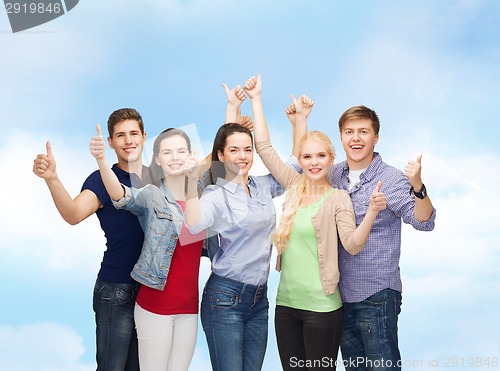 Image of group of smiling students showing thumbs up