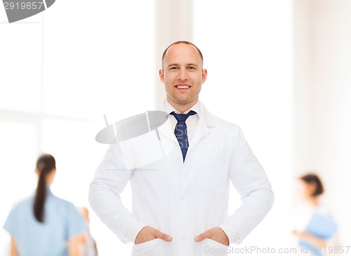 Image of smiling male doctor in white coat