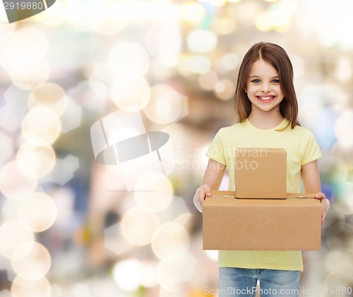 Image of smiling little girl in white blank t-shirt