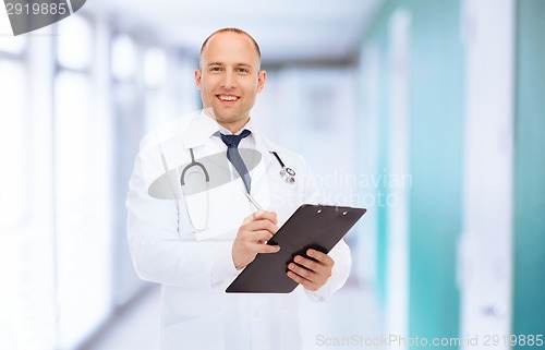 Image of smiling male doctor with clipboard and stethoscope