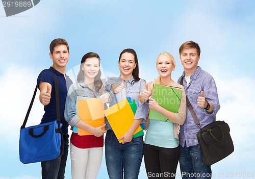 Image of group of smiling students showing thumbs up