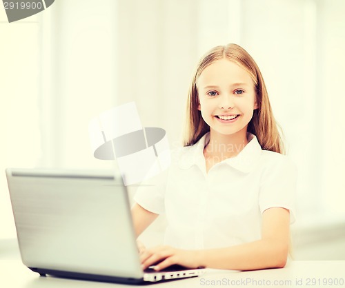 Image of girl with laptop pc at school