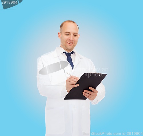 Image of smiling male doctor with clipboard