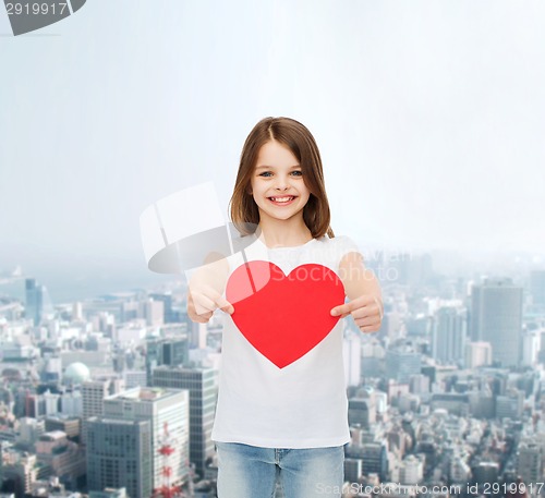 Image of smiling little girl in white blank t-shirt