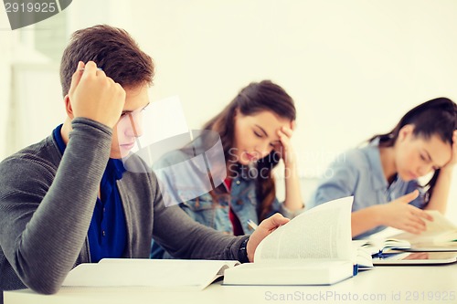 Image of students with notebooks and tablet pc at school
