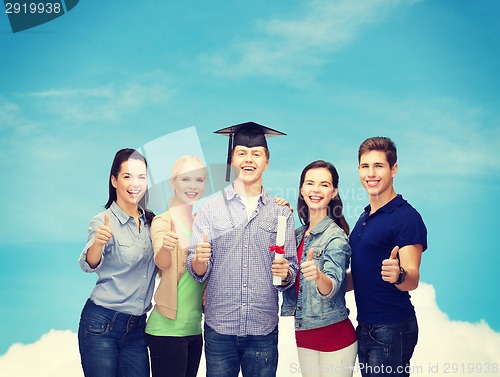 Image of group of students with diploma showing thumbs up