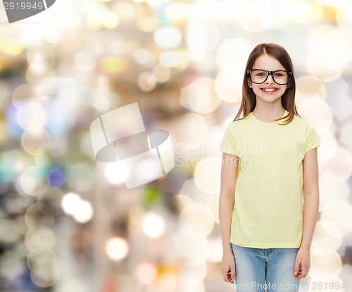 Image of smiling cute little girl in black eyeglasses