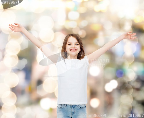 Image of smiling little girl in white blank t-shirt