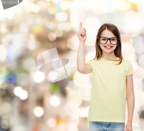 Image of smiling cute little girl in black eyeglasses