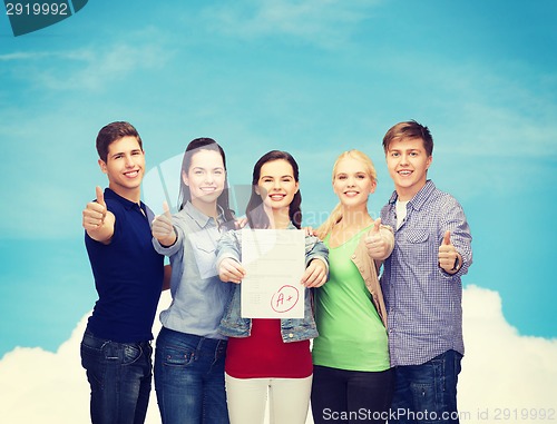 Image of group of students showing test and thumbs up