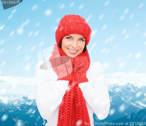 Image of smiling young woman in winter clothes