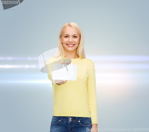 Image of smiling girl with blank business or name card