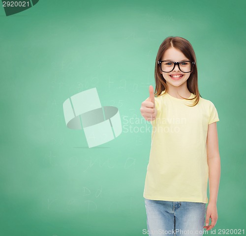 Image of smiling cute little girl in black eyeglasses