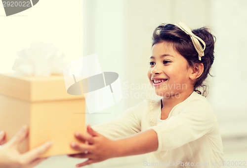 Image of happy child girl with gift box