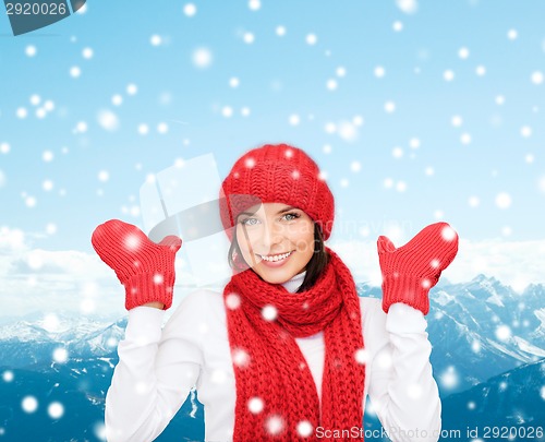 Image of smiling young woman in winter clothes