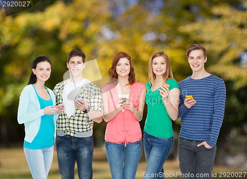 Image of smiling students with smartphones