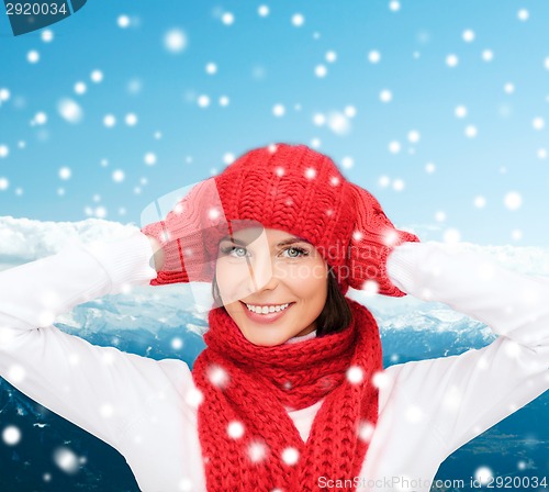 Image of smiling young woman in winter clothes