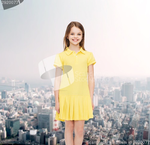 Image of smiling little girl in yellow dress