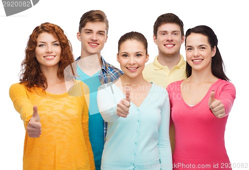 Image of group of smiling teenagers showing thumbs up