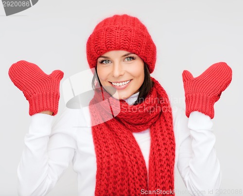 Image of smiling young woman in winter clothes