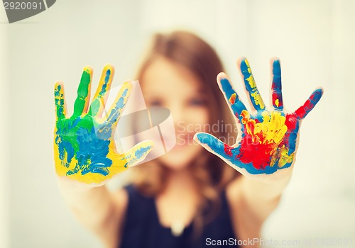 Image of girl showing painted hands