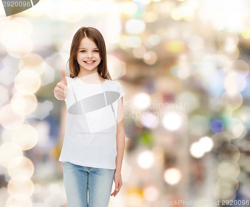 Image of smiling little girl in white blank t-shirt