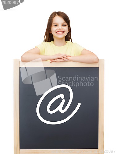 Image of happy little girl with blackboard