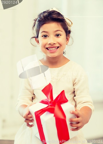 Image of happy child girl with gift box