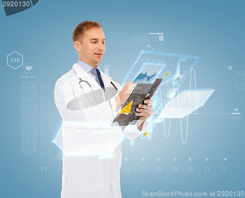 Image of smiling male doctor with clipboard and stethoscope