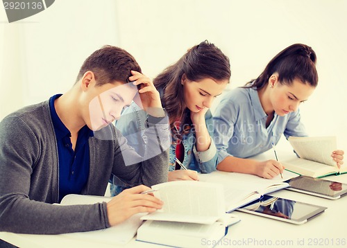 Image of students with notebooks and tablet pc at school