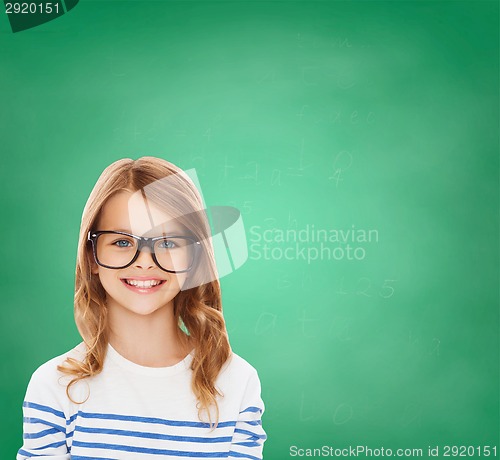 Image of smiling cute little girl with black eyeglasses