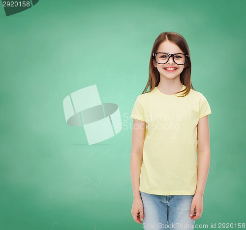 Image of smiling cute little girl in black eyeglasses