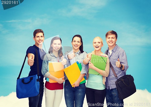 Image of group of smiling students showing thumbs up