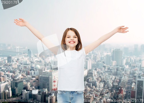 Image of smiling little girl in white blank t-shirt