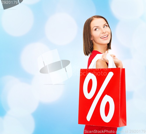 Image of woman in red dress with shopping bags