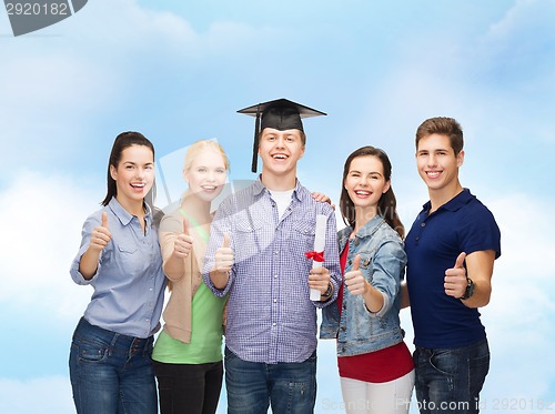 Image of group of students with diploma showing thumbs up