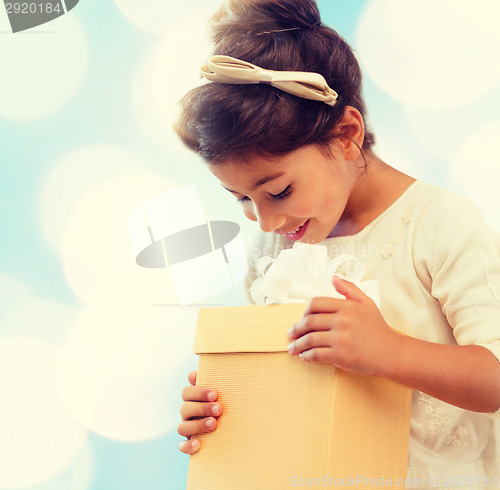 Image of happy child girl with gift box