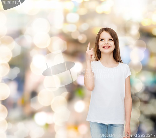 Image of smiling little girl in white blank t-shirt