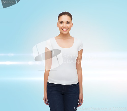Image of smiling young woman in blank white t-shirt