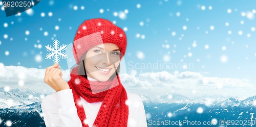 Image of smiling young woman in winter clothes