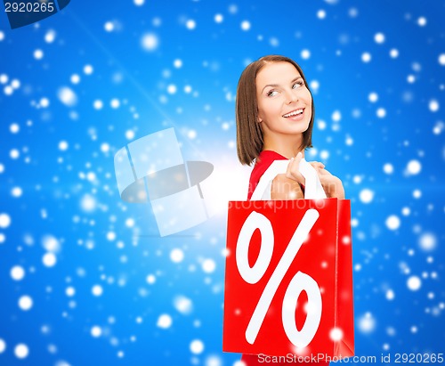 Image of woman in red dress with shopping bags