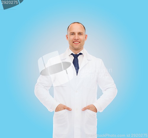 Image of smiling male doctor in white coat