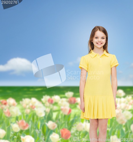 Image of smiling little girl in yellow dress