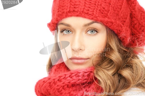 Image of close up of smiling young woman in winter clothes