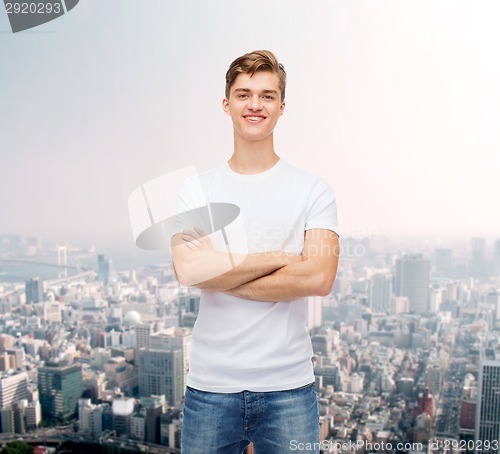 Image of smiling young man in blank white t-shirt