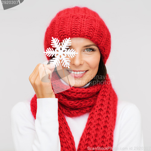 Image of smiling young woman in winter clothes