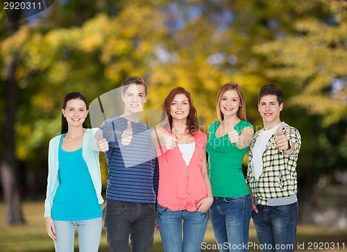 Image of group of smiling students showing thumbs up