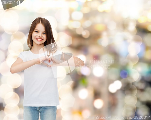 Image of smiling little girl in white blank t-shirt