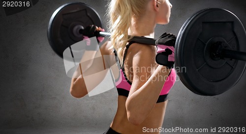 Image of close up of sporty woman exercising with barbell