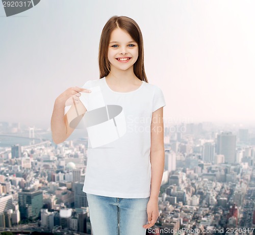 Image of smiling little girl in white blank t-shirt